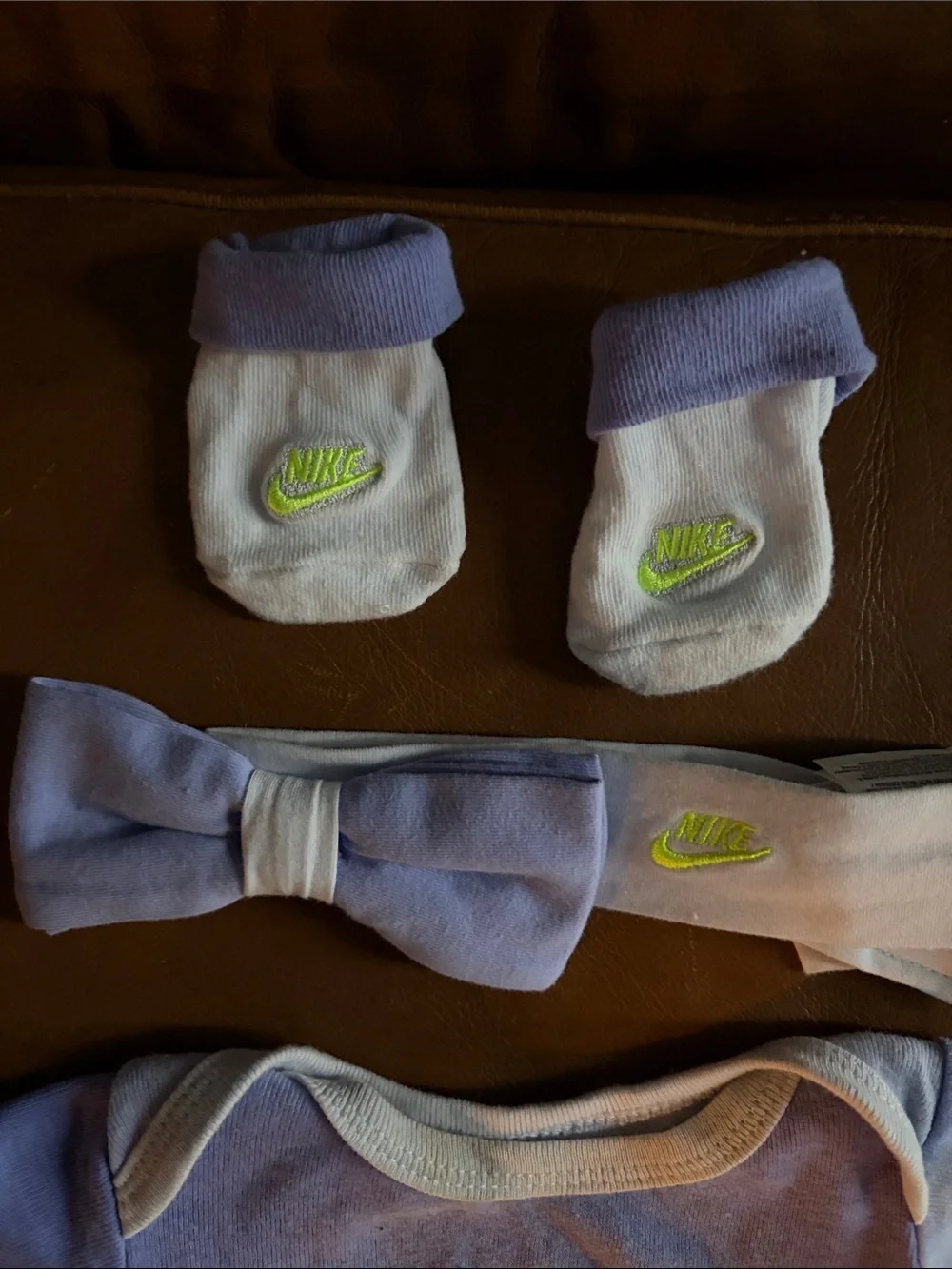 Nike Baby One-Piece Bodysuit in Light Purple with Neon Logo